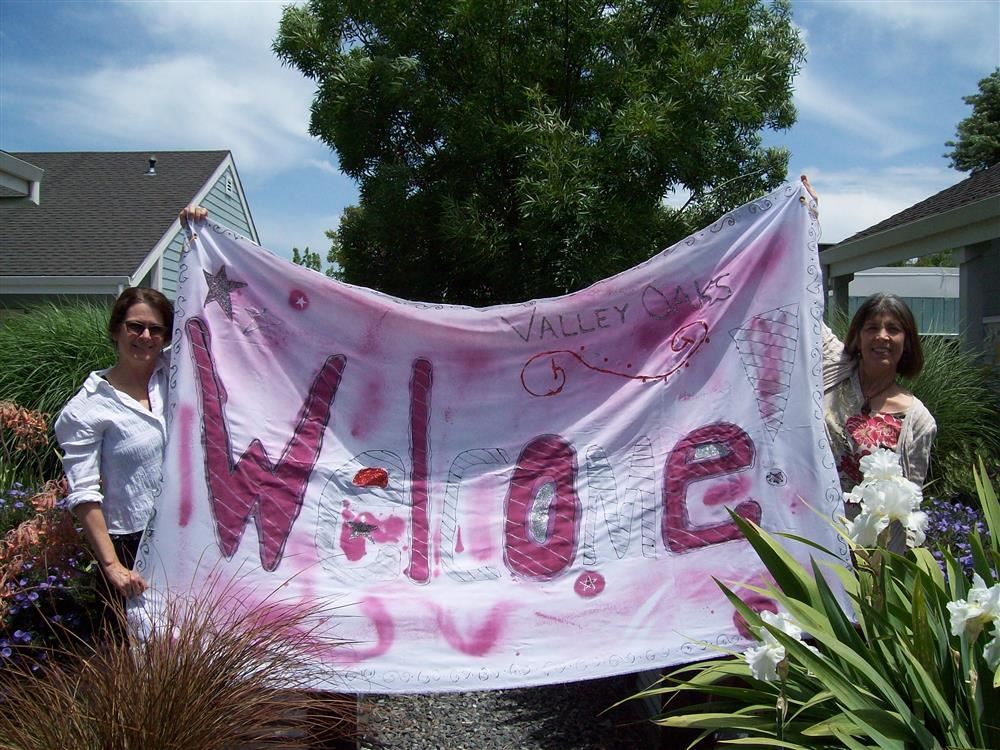 Photo of Valley Oaks staff holding welcome banner