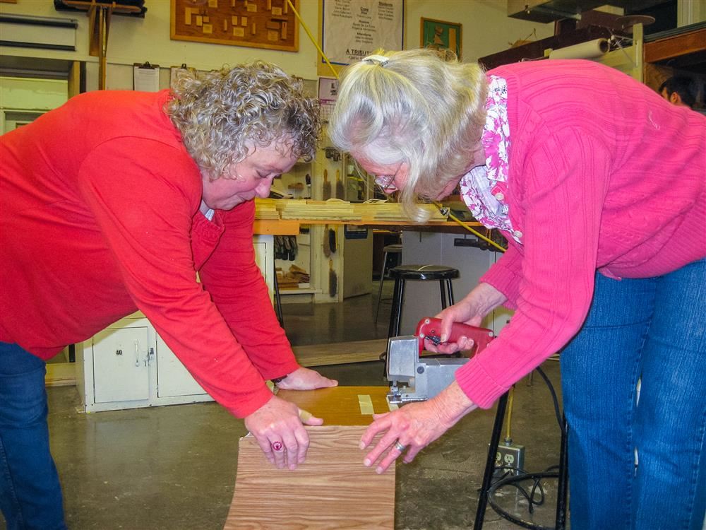 Community education students learning woodworking