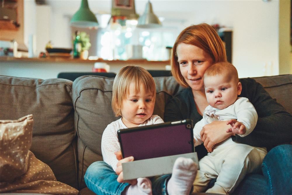 Family looking at iPad together