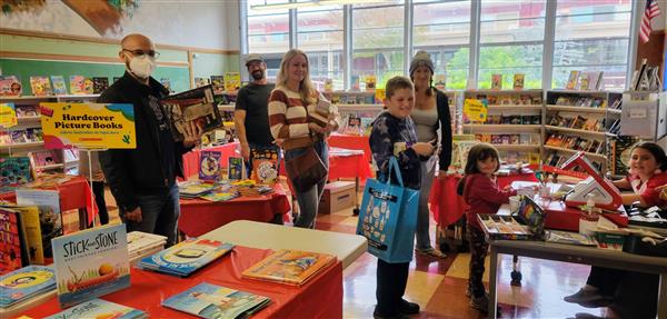 People browsing at the Scholastic Book Fair.