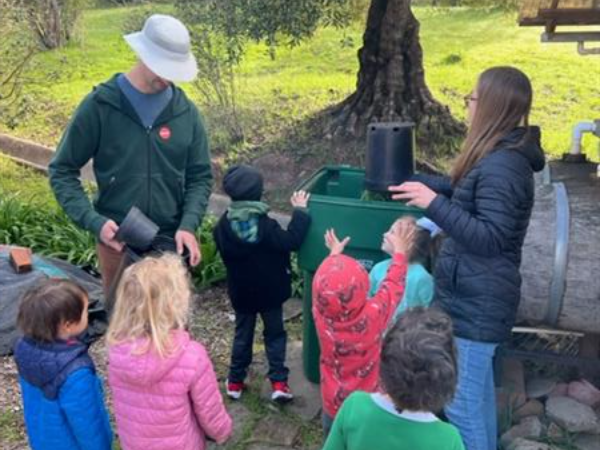 Transitional Kindergarten students using the green waste